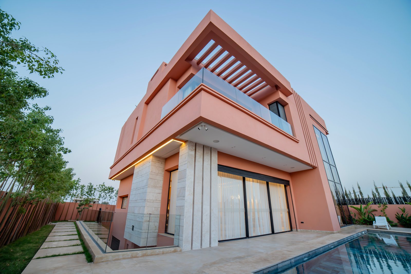 Private pool area at Bin Eissa Real Estate with luxurious loungers